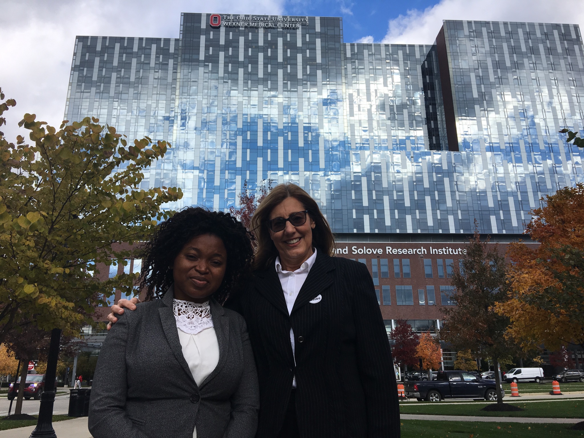 Gwaliwa and Margo in front of the Wexner Medical Center